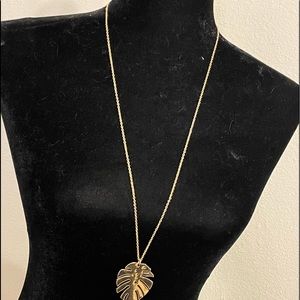 Gold toned plant leaf necklace